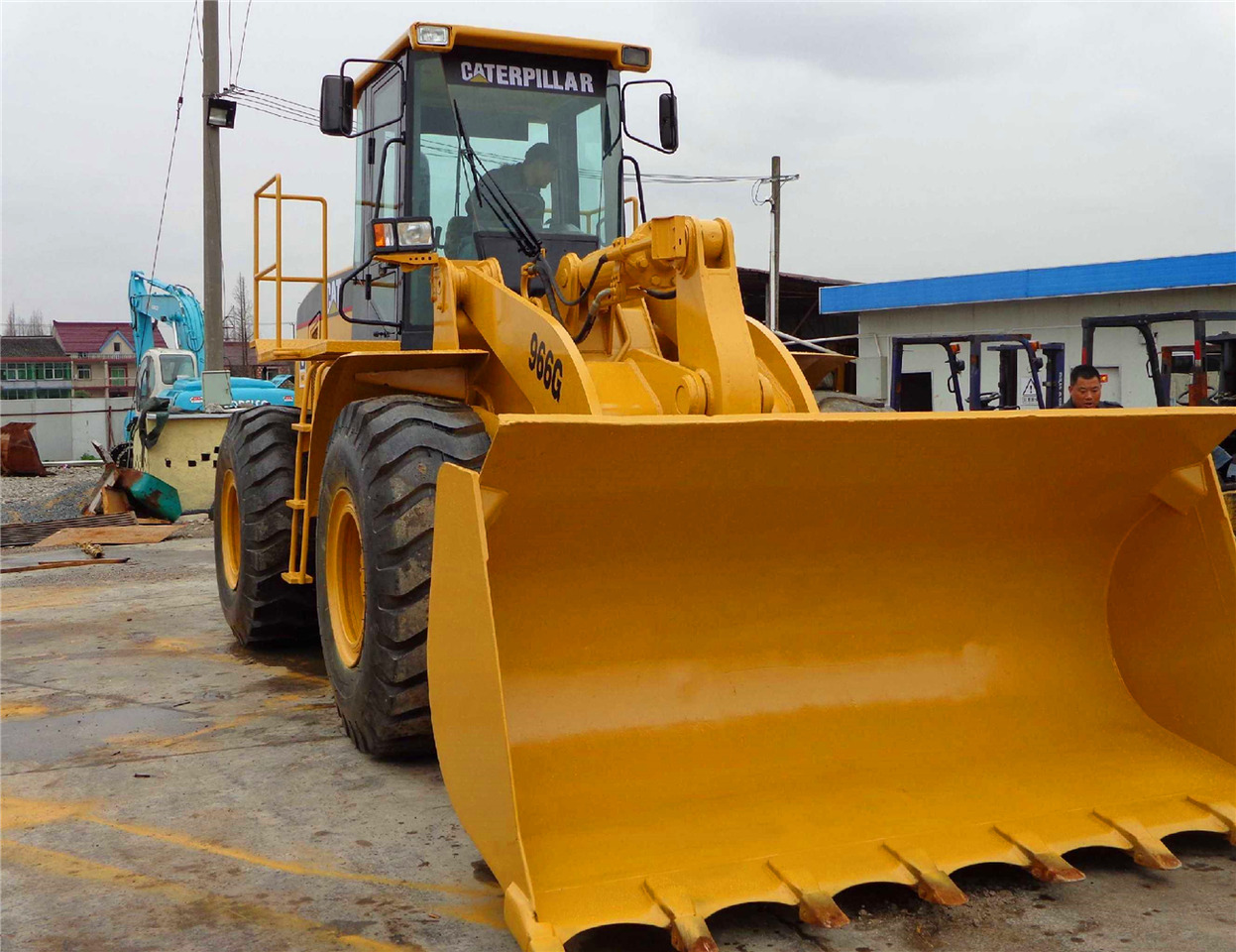 Caterpillar 966G - Gumikerekes homlokrakodó: 1 kép. Caterpillar 966G - Gumikerekes homlokrakodó: 1 kép.