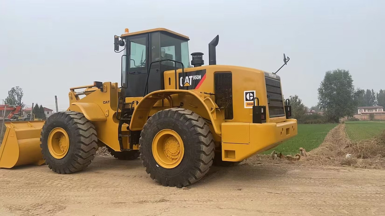 CATERPILLAR 950H CAT 966H 950GC - Gumikerekes homlokrakodó: 4 kép. CATERPILLAR 950H CAT 966H 950GC - Gumikerekes homlokrakodó: 4 kép.