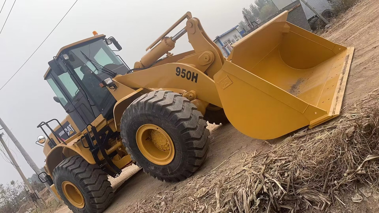CATERPILLAR 950H CAT 966H 950GC - Gumikerekes homlokrakodó: 1 kép. CATERPILLAR 950H CAT 966H 950GC - Gumikerekes homlokrakodó: 1 kép.