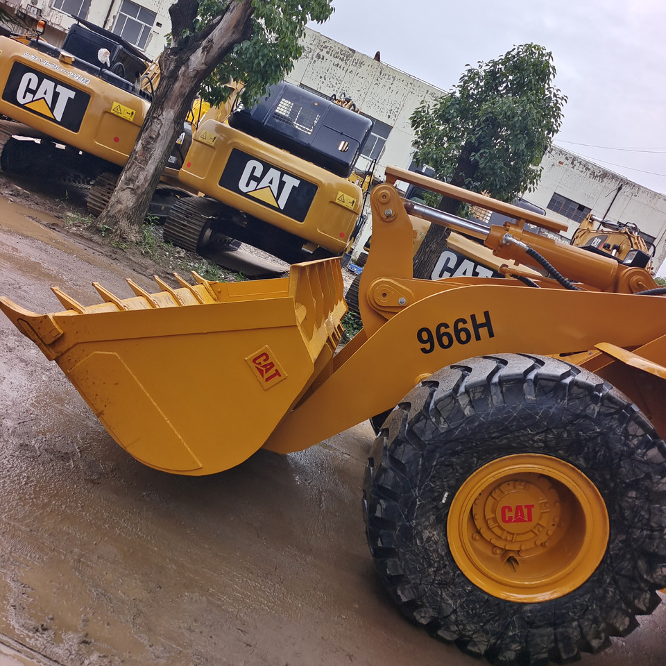 CATERPILLAR 966H CAT 966 H 950GC 950H - Gumikerekes homlokrakodó: 2 kép. CATERPILLAR 966H CAT 966 H 950GC 950H - Gumikerekes homlokrakodó: 2 kép.
