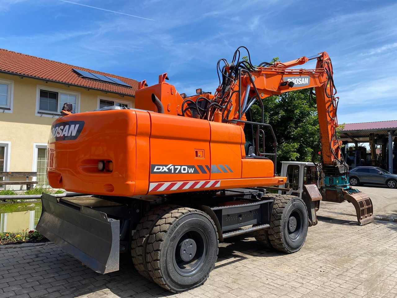 Doosan DX 170 W - Gumikerekes kotró: 5 kép. Doosan DX 170 W - Gumikerekes kotró: 5 kép.
