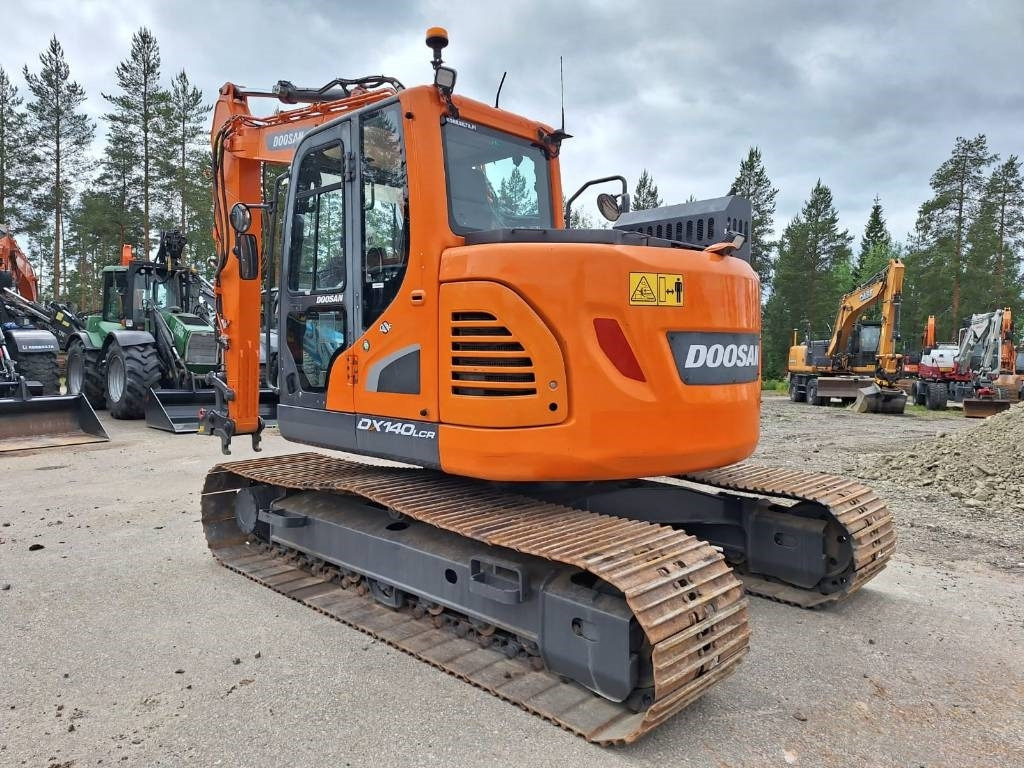 Doosan DX140LCR-5 - Lánctalpas kotró: 2 kép. Doosan DX140LCR-5 - Lánctalpas kotró: 2 kép.