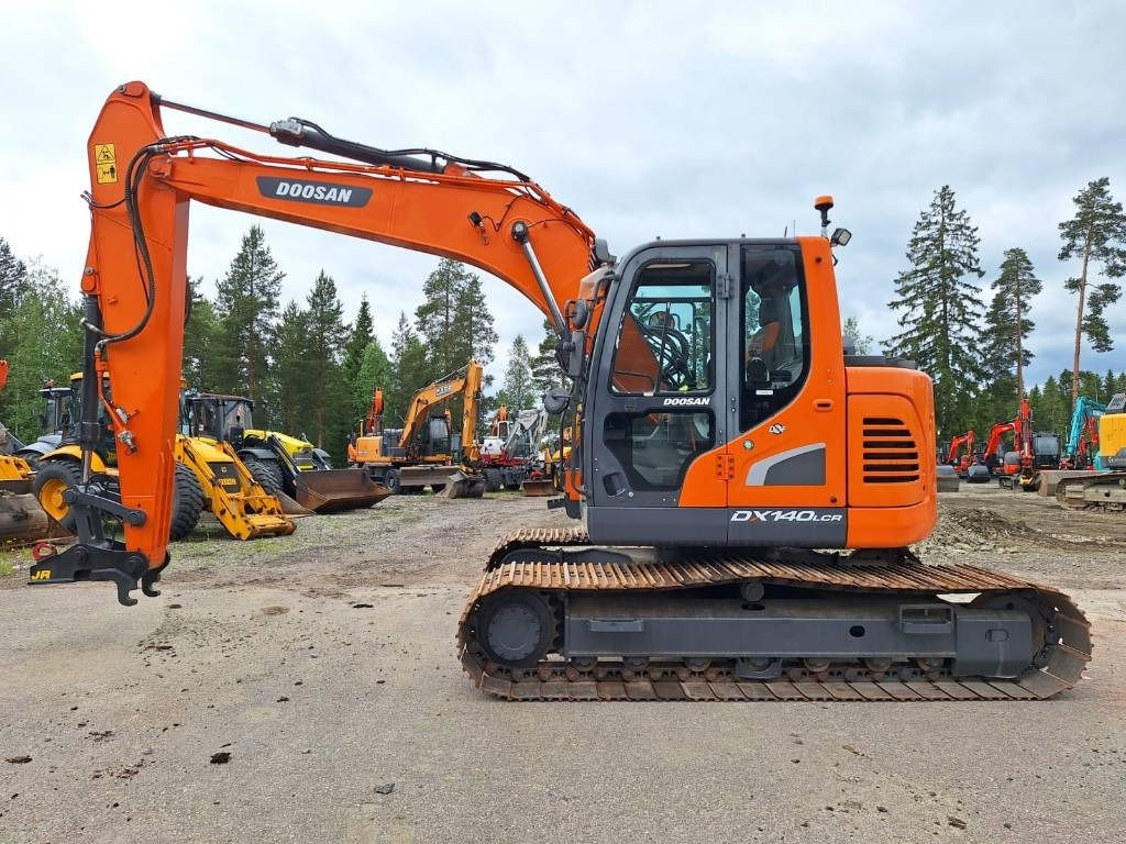 Doosan DX140LCR-5 - Lánctalpas kotró: 1 kép. Doosan DX140LCR-5 - Lánctalpas kotró: 1 kép.