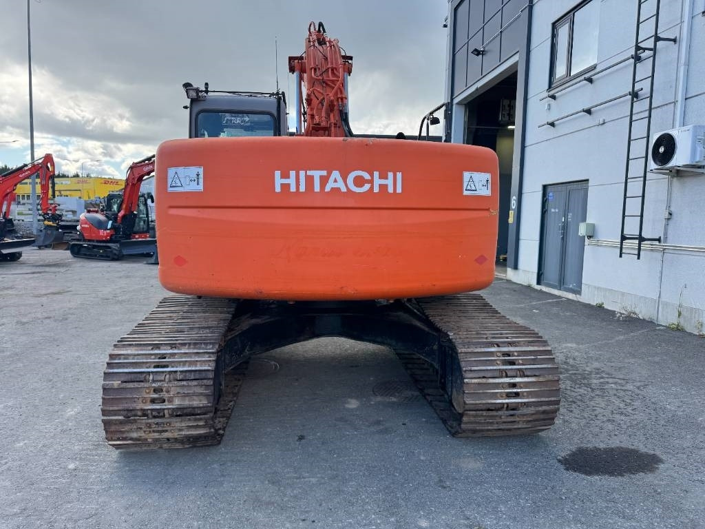 Hitachi ZX225USR PYÖRITTÄJÄLLÄ - Lánctalpas kotró: 4 kép. Hitachi ZX225USR PYÖRITTÄJÄLLÄ - Lánctalpas kotró: 4 kép.
