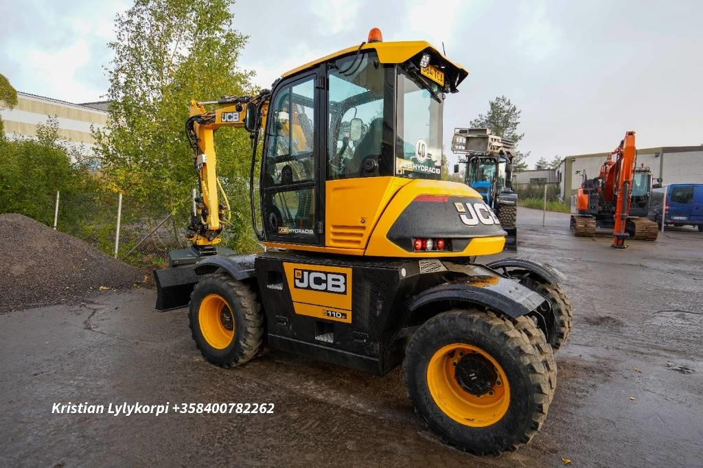 JCB 110W Hydradig PYÖRITTÄJÄLLÄ - Gumikerekes kotró: 2 kép. JCB 110W Hydradig PYÖRITTÄJÄLLÄ - Gumikerekes kotró: 2 kép.