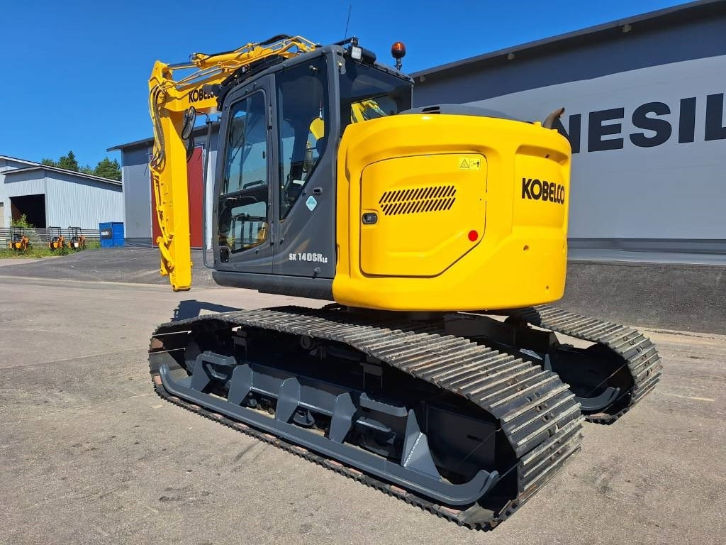 Kobelco SK140SRLC-7 KOROTETTU SUOALUSTA 900MM - Lánctalpas kotró: 2 kép. Kobelco SK140SRLC-7 KOROTETTU SUOALUSTA 900MM - Lánctalpas kotró: 2 kép.