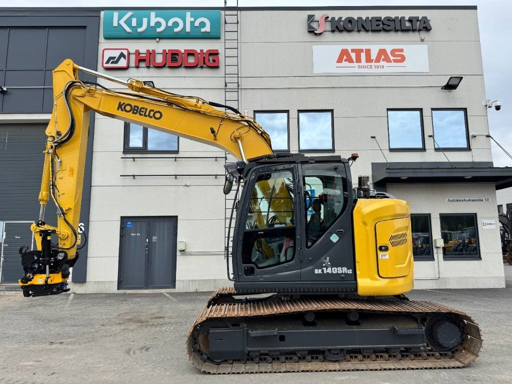 Kobelco SK140SRLC-7 UUSI ENGCON EC219 - Lánctalpas kotró: 1 kép. Kobelco SK140SRLC-7 UUSI ENGCON EC219 - Lánctalpas kotró: 1 kép.