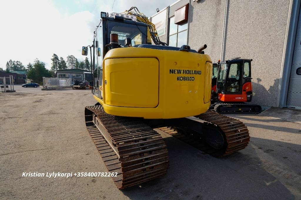 New Holland E140CSR PYÖRITTÄJÄLLÄ - Lánctalpas kotró: 2 kép. New Holland E140CSR PYÖRITTÄJÄLLÄ - Lánctalpas kotró: 2 kép.