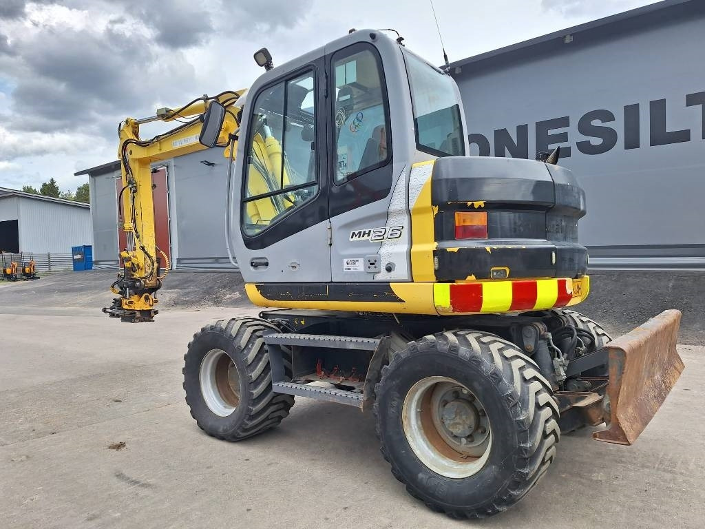 New Holland MYYTY! SOLD! MH2.6 ENGCON PIHDEILLÄ - Gumikerekes kotró: 2 kép. New Holland MYYTY! SOLD! MH2.6 ENGCON PIHDEILLÄ - Gumikerekes kotró: 2 kép.