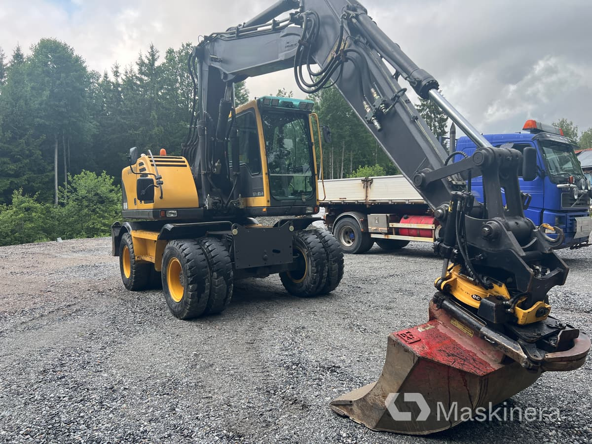 Hjulgrävare Volvo EW140B - Lánctalpas kotró: 3 kép. Hjulgrävare Volvo EW140B - Lánctalpas kotró: 3 kép.