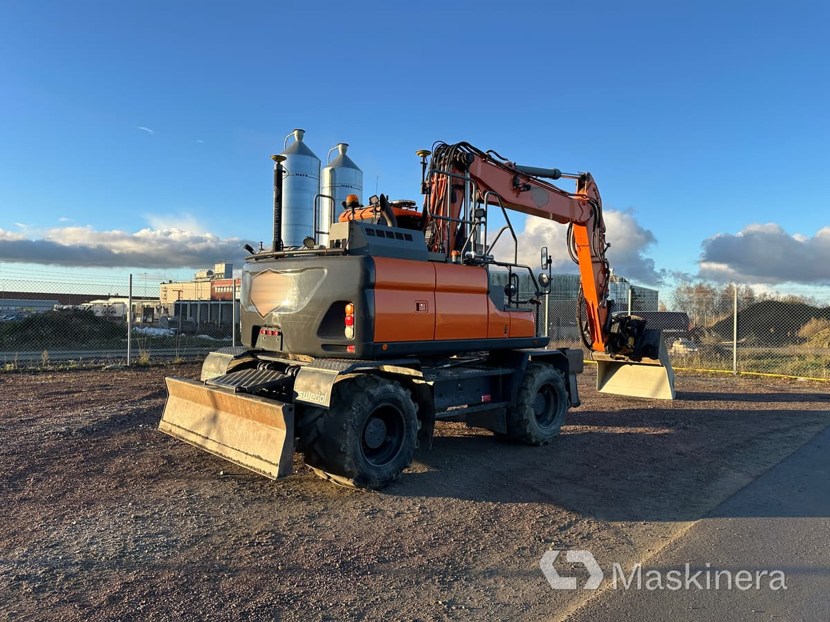 Hjulgrävare Doosan DX160W-5 - Lánctalpas kotró: 5 kép. Hjulgrävare Doosan DX160W-5 - Lánctalpas kotró: 5 kép.