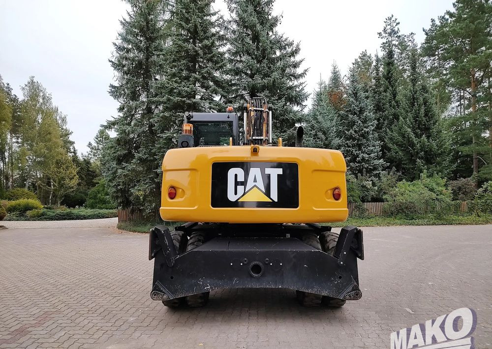 Caterpillar M313D - Gumikerekes kotró: 3 kép. Caterpillar M313D - Gumikerekes kotró: 3 kép.