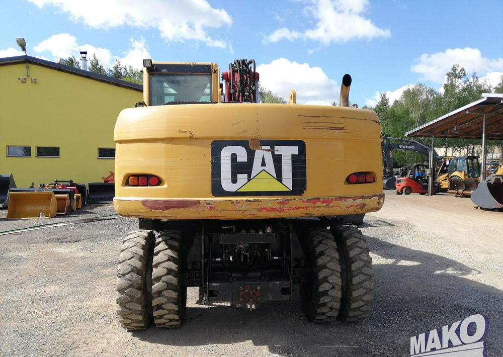 Caterpillar M315 C - Gumikerekes kotró: 4 kép. Caterpillar M315 C - Gumikerekes kotró: 4 kép.