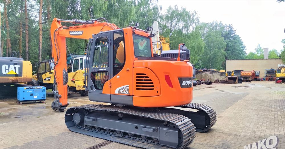 Doosan DX140LCR-5 - Lánctalpas kotró: 2 kép. Doosan DX140LCR-5 - Lánctalpas kotró: 2 kép.