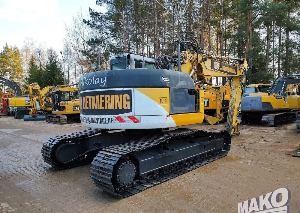 Komatsu PC228USLC-3 - Lánctalpas kotró: 4 kép. Komatsu PC228USLC-3 - Lánctalpas kotró: 4 kép.