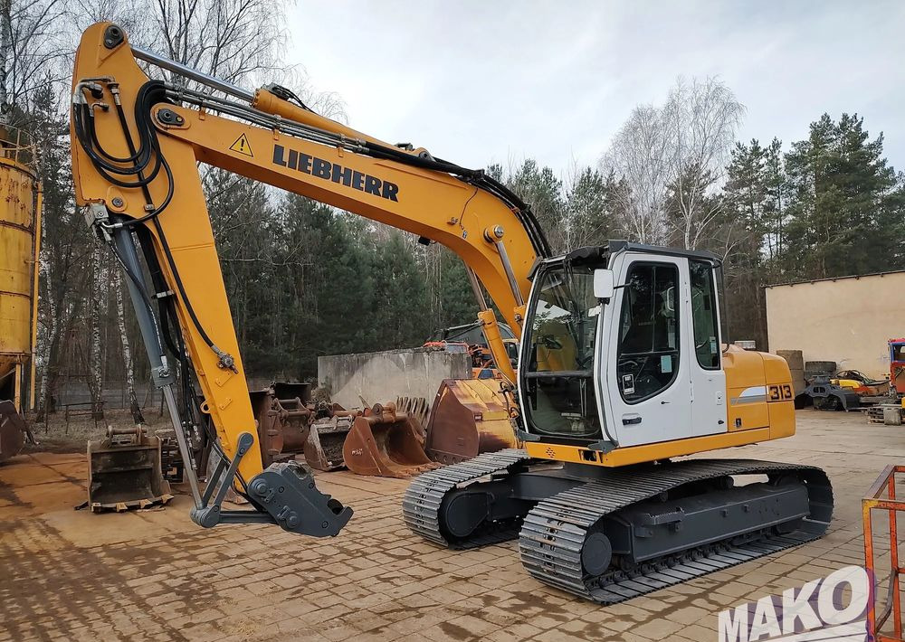 Liebherr R 313 Litronic - Lánctalpas kotró: 2 kép. Liebherr R 313 Litronic - Lánctalpas kotró: 2 kép.