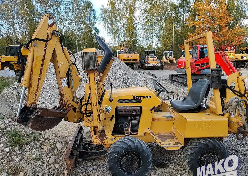 Vermeer RT450 - Gumikerekes kotró: 2 kép. Vermeer RT450 - Gumikerekes kotró: 2 kép.