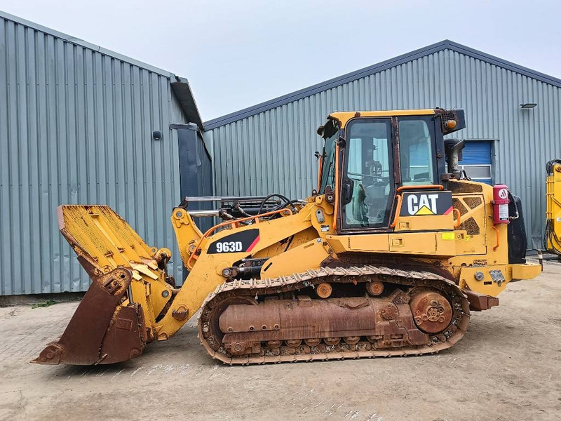Cat 963 D crawler loader tracked rupslader raupen 20 t - Lánctalpas homlokrakodó: 2 kép. Cat 963 D crawler loader tracked rupslader raupen 20 t - Lánctalpas homlokrakodó: 2 kép.