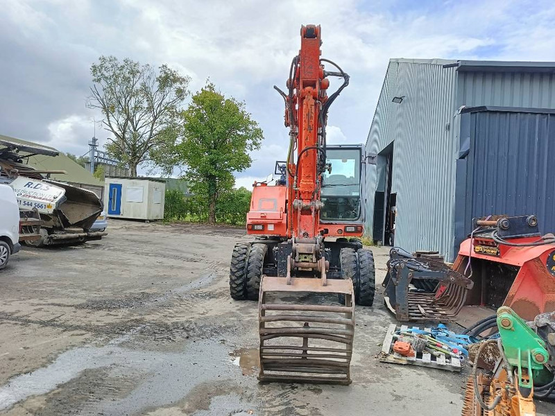 FIAT-HITACHI FH120W bandenkraan Wheel Excavator graafmachine - Gumikerekes kotró: 4 kép. FIAT-HITACHI FH120W bandenkraan Wheel Excavator graafmachine - Gumikerekes kotró: 4 kép.