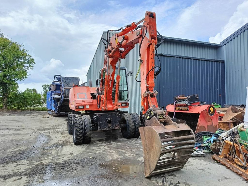 FIAT-HITACHI FH120W bandenkraan Wheel Excavator graafmachine - Gumikerekes kotró: 3 kép. FIAT-HITACHI FH120W bandenkraan Wheel Excavator graafmachine - Gumikerekes kotró: 3 kép.