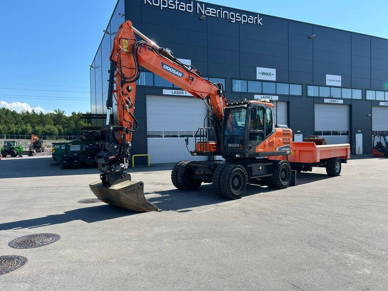 Doosan DX 140 W-5 - Gumikerekes kotró: 2 kép. Doosan DX 140 W-5 - Gumikerekes kotró: 2 kép.