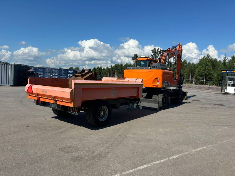 Doosan DX 140 W-5 - Gumikerekes kotró: 4 kép. Doosan DX 140 W-5 - Gumikerekes kotró: 4 kép.