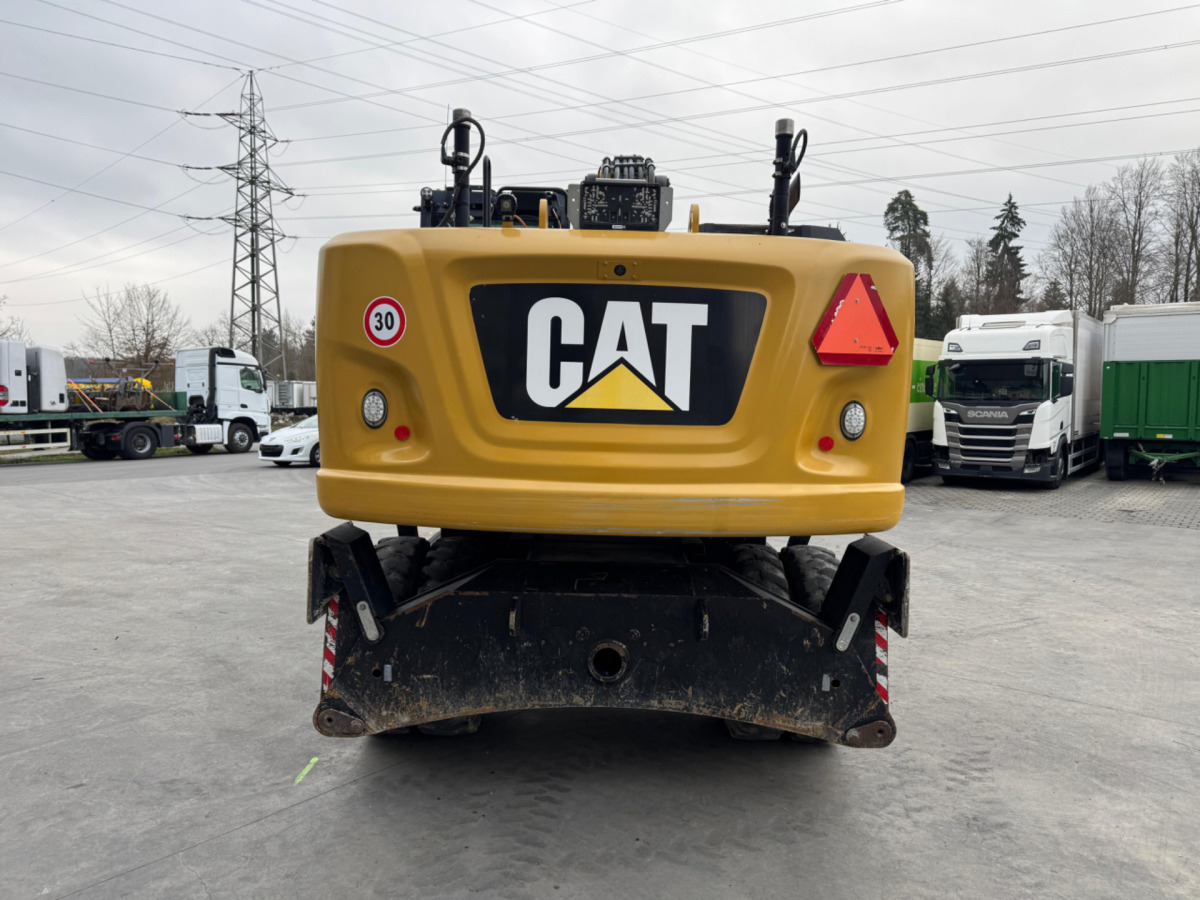 CATERPILLAR M320F Oilquick - Gumikerekes kotró: 5 kép. CATERPILLAR M320F Oilquick - Gumikerekes kotró: 5 kép.
