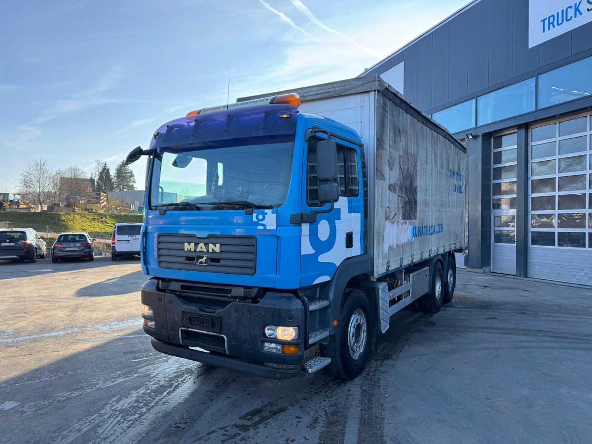 MAN TGA 26.440 6x2 - Ponyvás teherautó: 1 kép. MAN TGA 26.440 6x2 - Ponyvás teherautó: 1 kép.