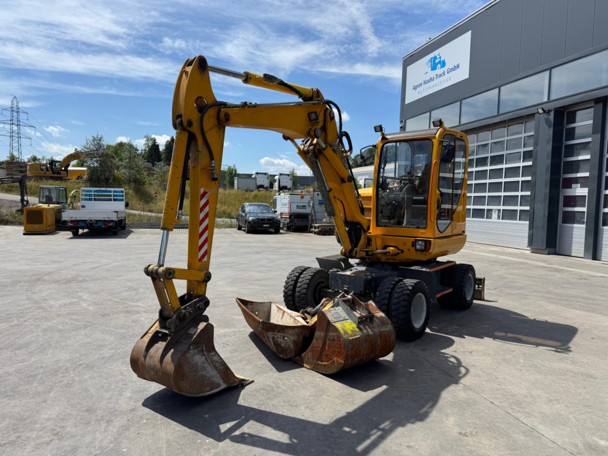 NEUSON 6503 4x Schaufeln - Gumikerekes kotró: 1 kép. NEUSON 6503 4x Schaufeln - Gumikerekes kotró: 1 kép.