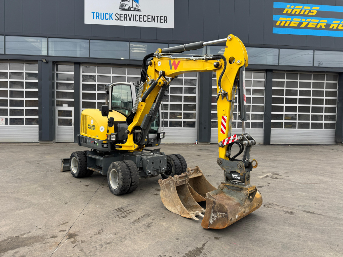 NEUSON EW65 E14-2 Powertilt 3x Schaufeln - Gumikerekes kotró: 2 kép. NEUSON EW65 E14-2 Powertilt 3x Schaufeln - Gumikerekes kotró: 2 kép.