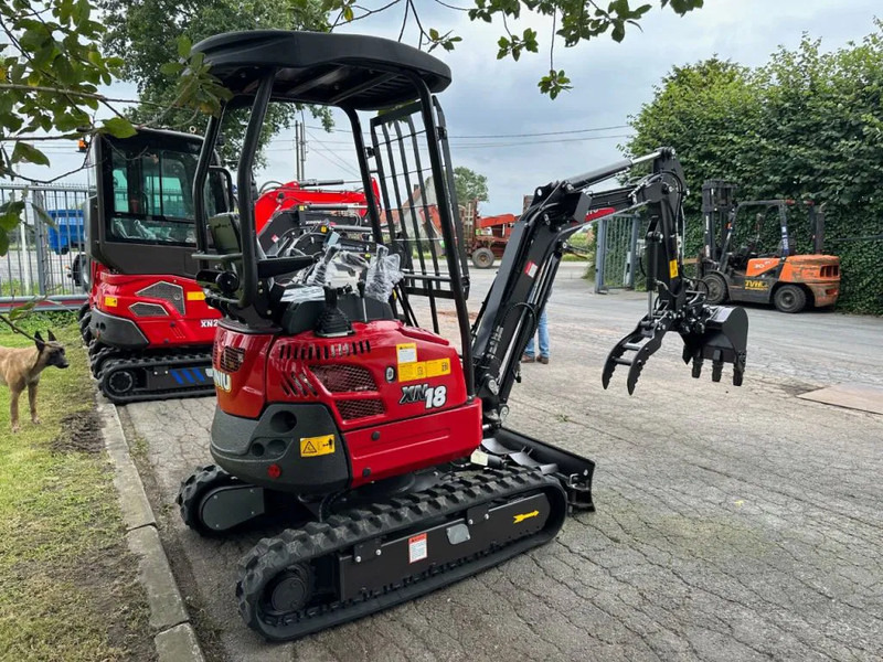 Rhino Rhinoceros XN18 - Minikotró: 2 kép. Rhino Rhinoceros XN18 - Minikotró: 2 kép.