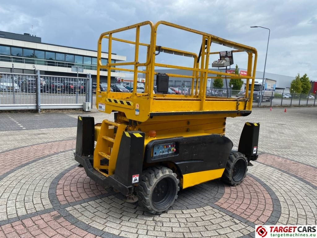 Haulotte Compact 12DX Diesel 4x4 Scissor Work Lift 1206cm - Ollós emelő: 3 kép. Haulotte Compact 12DX Diesel 4x4 Scissor Work Lift 1206cm - Ollós emelő: 3 kép.