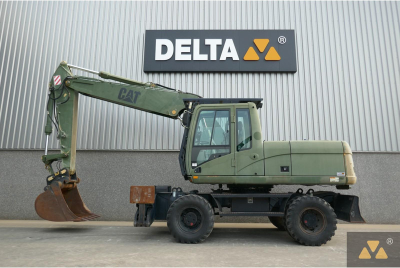 Caterpillar M318C Ex- - Gumikerekes kotró: 1 kép. Caterpillar M318C Ex- - Gumikerekes kotró: 1 kép.