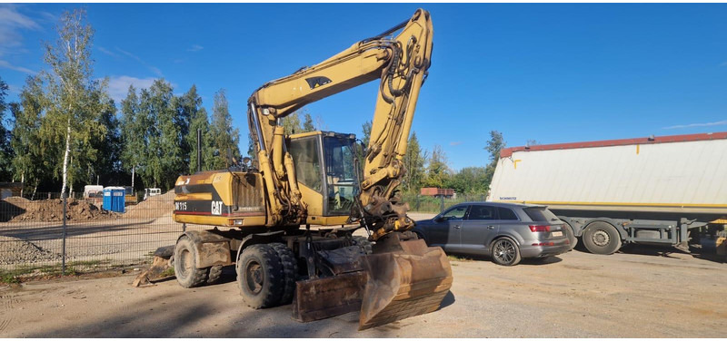Caterpillar M 315 Rototilt - Gumikerekes kotró: 1 kép. Caterpillar M 315 Rototilt - Gumikerekes kotró: 1 kép.