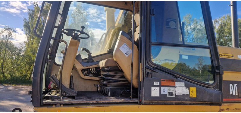 Caterpillar M 315 Rototilt - Gumikerekes kotró: 5 kép. Caterpillar M 315 Rototilt - Gumikerekes kotró: 5 kép.