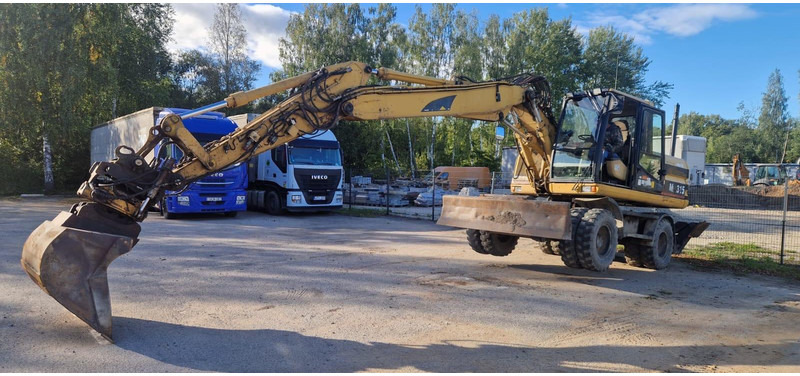 Caterpillar M 315 Rototilt - Gumikerekes kotró: 4 kép. Caterpillar M 315 Rototilt - Gumikerekes kotró: 4 kép.