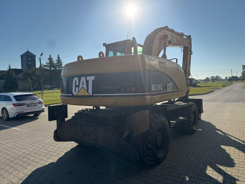 Caterpillar M 316 C - Gumikerekes kotró: 3 kép. Caterpillar M 316 C - Gumikerekes kotró: 3 kép.