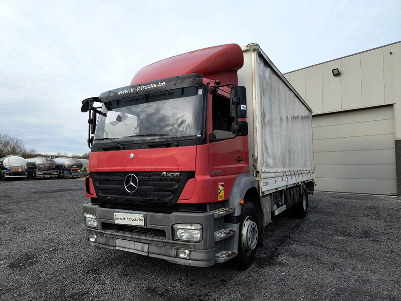Mercedes-Benz Axor 1829 + D'HOLLANDIA 2000 KG - Ponyvás teherautó: 1 kép. Mercedes-Benz Axor 1829 + D'HOLLANDIA 2000 KG - Ponyvás teherautó: 1 kép.