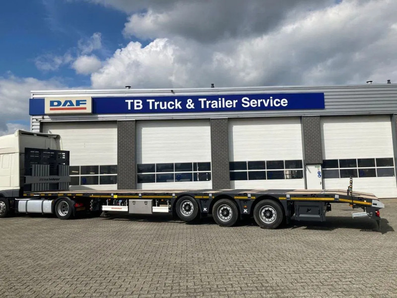 Kässbohrer SPS HM 3 / 0N - 18 / 27 Vlakke mega trailer met liftas, 18x rongen en kist voor de oprijplaten - Platós félpótkocsi: 3 kép. Kässbohrer SPS HM 3 / 0N - 18 / 27 Vlakke mega trailer met liftas, 18x rongen en kist voor de oprijplaten - Platós félpótkocsi: 3 kép.