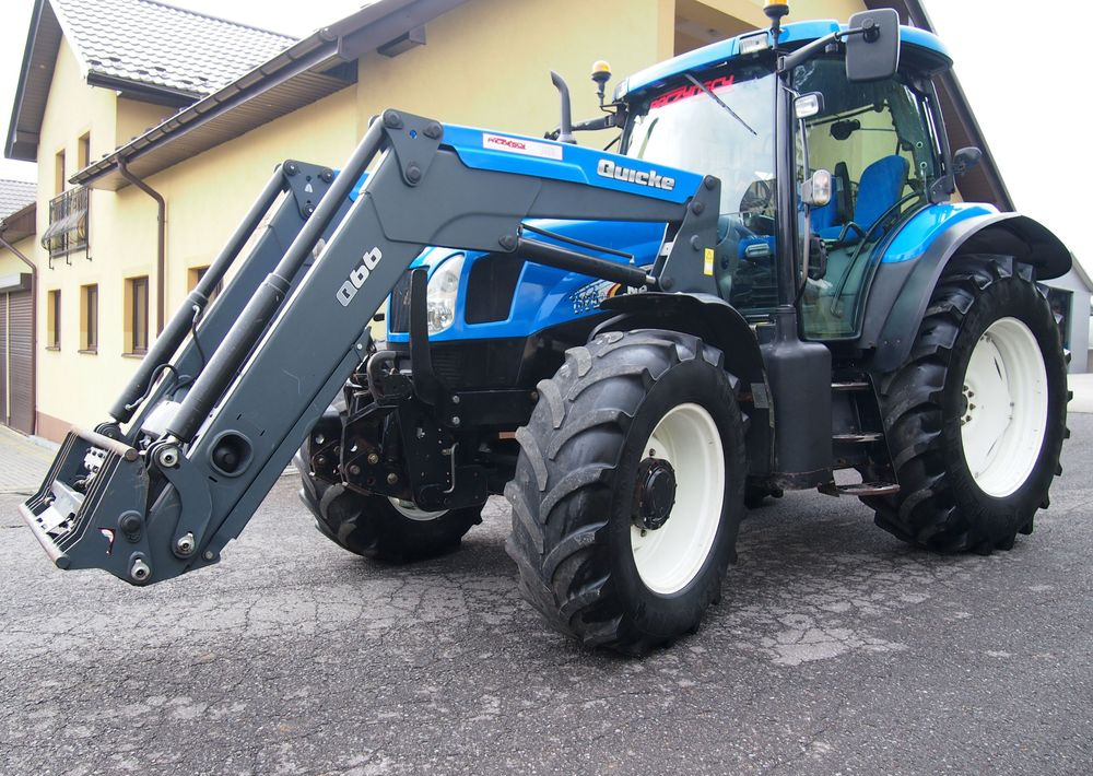 Ciągnik New Holland NH TS125A 6 cylindrów 2004 Ciągnik rolniczy New Holland TS125A - Traktor: 1 kép. Ciągnik New Holland NH TS125A 6 cylindrów 2004 Ciągnik rolniczy New Holland TS125A - Traktor: 1 kép.
