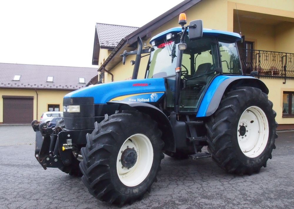 Ciągnik New Holland TM 140 2004 Przedni TUZ - Traktor: 3 kép. Ciągnik New Holland TM 140 2004 Przedni TUZ - Traktor: 3 kép.