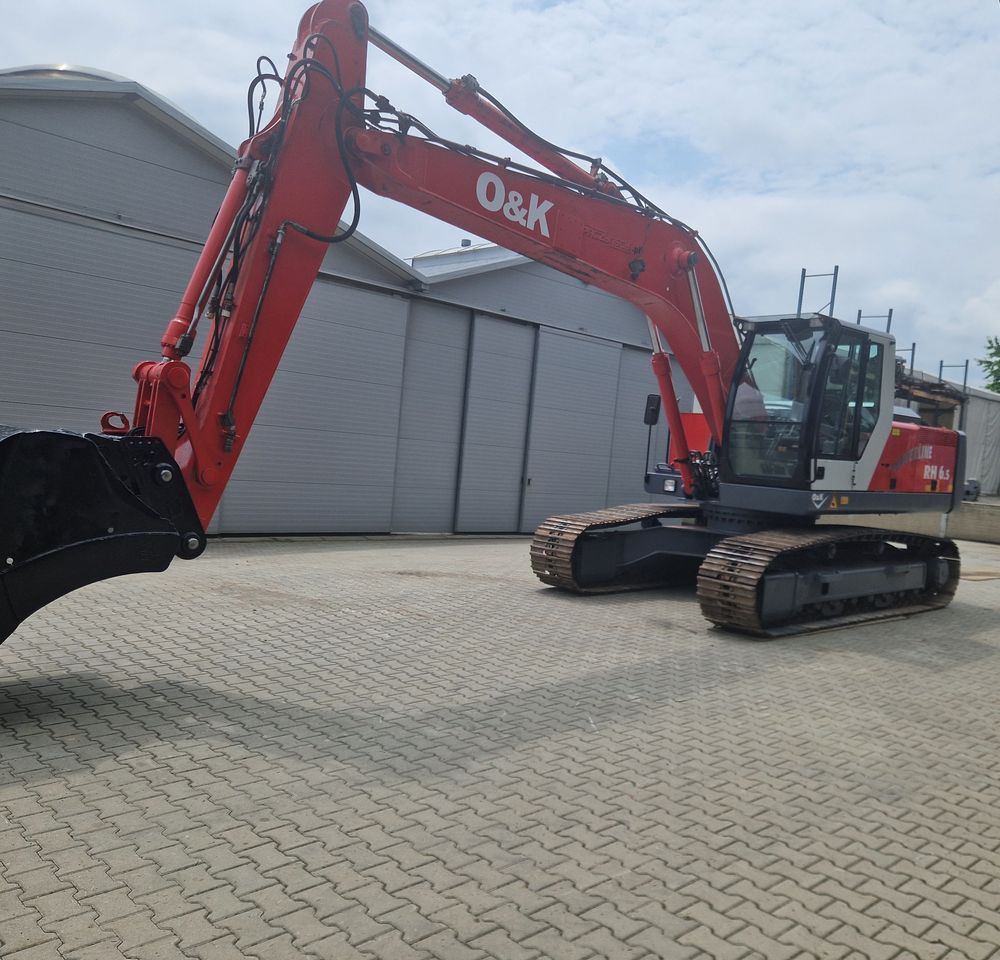 Koparka gąsienicowa O&K RH6,5 2003 Koparka gąsienicowa O&K - Lánctalpas kotró: 1 kép. Koparka gąsienicowa O&K RH6,5 2003 Koparka gąsienicowa O&K - Lánctalpas kotró: 1 kép.