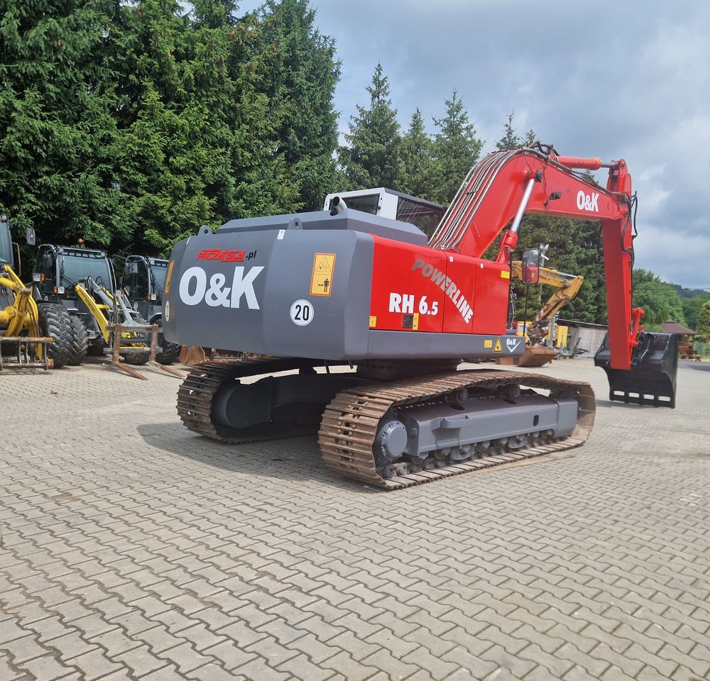 Koparka gąsienicowa O&K RH6,5 2003 Koparka gąsienicowa O&K - Lánctalpas kotró: 4 kép. Koparka gąsienicowa O&K RH6,5 2003 Koparka gąsienicowa O&K - Lánctalpas kotró: 4 kép.