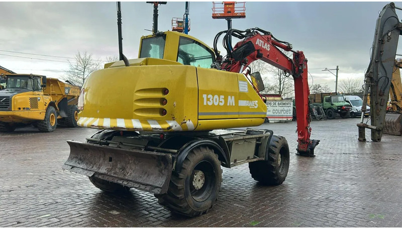 Atlas 1305 - Gumikerekes kotró: 3 kép. Atlas 1305 - Gumikerekes kotró: 3 kép.