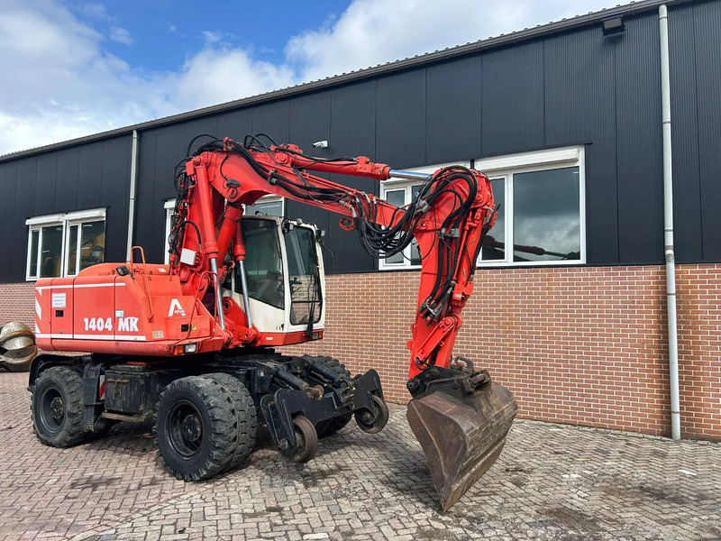 Atlas 1404 - Gumikerekes kotró: 2 kép. Atlas 1404 - Gumikerekes kotró: 2 kép.