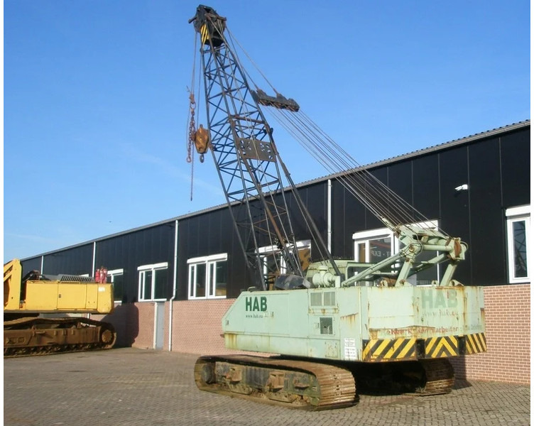 Hitachi KH125-3 - Lánctalpas daru: 2 kép. Hitachi KH125-3 - Lánctalpas daru: 2 kép.