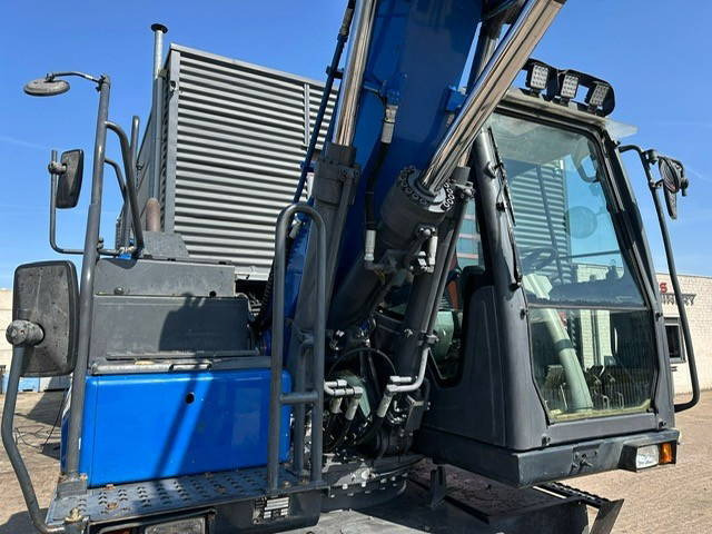 Doosan DX170W - Gumikerekes kotró: 4 kép. Doosan DX170W - Gumikerekes kotró: 4 kép.
