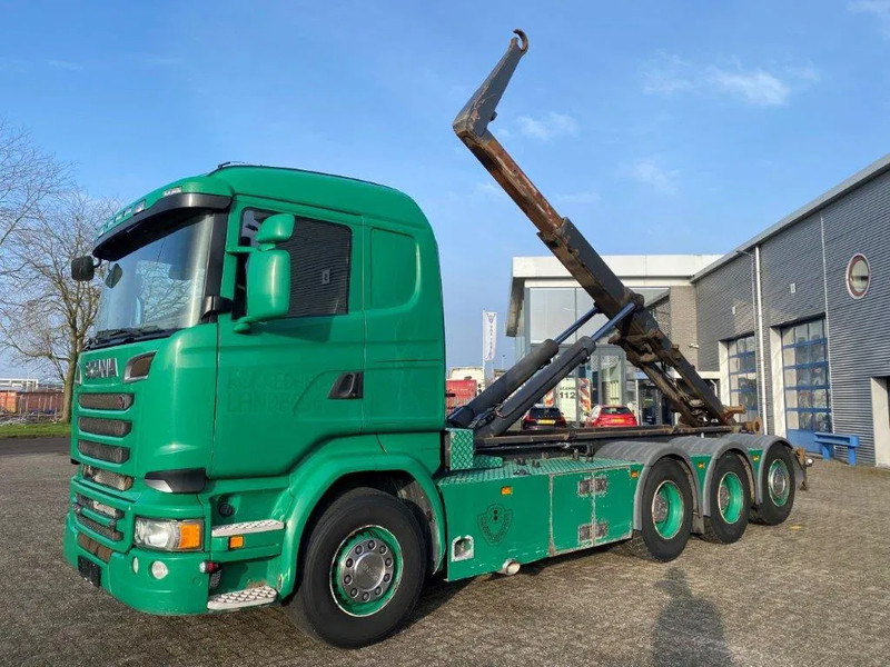 Scania R520 V8 / 8X4 / BIG AXLE / AJK HOOKLIFT 30TON / LIFT+LENKACHSE / NAVI / LEATHER / FULL-AIR / AUTOMATIC / EURO-6 / 2015 - Horgos rakodó teherautó: 1 kép. Scania R520 V8 / 8X4 / BIG AXLE / AJK HOOKLIFT 30TON / LIFT+LENKACHSE / NAVI / LEATHER / FULL-AIR / AUTOMATIC / EURO-6 / 2015 - Horgos rakodó teherautó: 1 kép.