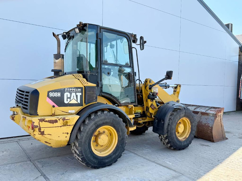 Cat 908H - Quick Coupler / Automatic Greasing - Gumikerekes homlokrakodó: 5 kép. Cat 908H - Quick Coupler / Automatic Greasing - Gumikerekes homlokrakodó: 5 kép.