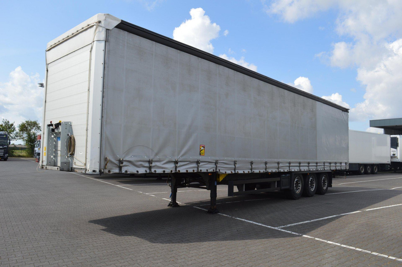 Schmitz Cargobull SCS24/L - Ponyvás félpótkocsi: 1 kép. Schmitz Cargobull SCS24/L - Ponyvás félpótkocsi: 1 kép.
